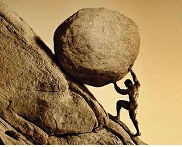 Man pushing rock up hill